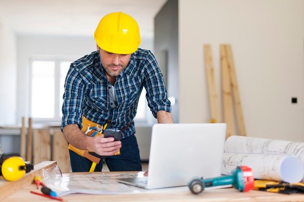 Busy building contractor at work How to Choose the Right Home Improvement Contractor in USA