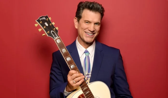 chris isaak net worth Chris Isaak performing live on stage, representing his career success and wealth — a visual insight into chris isaak net worth in 2025.
